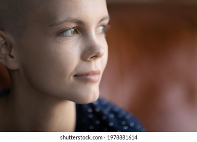 Face Of Thoughtful Hairless Oncology Patient Thinking Of Life After Disease, Treatment, Chemotherapy, Hoping For Recovery, Dreaming Of Good Future. Pensive Woman With Cancer Looking Away. Close Up