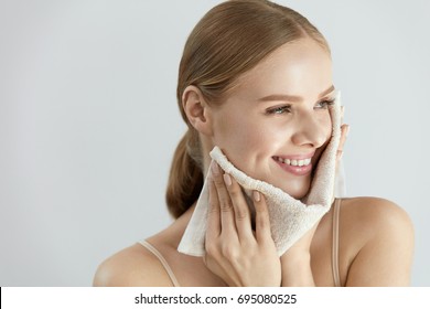 Face Washing. Closeup Of Happy Woman Drying Skin With Towel. High Resolution