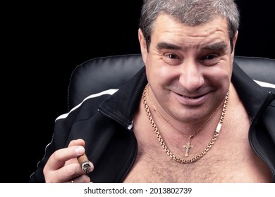 The Face Of A White Fat Grown-up Man In Close-up. The Smile Of A Russian Criminal Authority Or Bandit, Smoking A Cigar Portrait