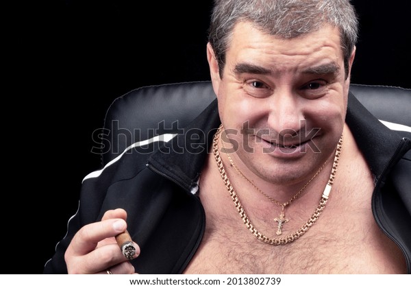 the face of a white fat grown-up man in close-up. the smile of a Russian criminal authority or bandit, smoking a cigar portrait