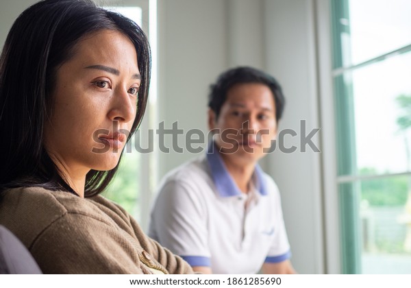The face of the wife is sad and\
angry husband after having divorced love trouble. Concepts of\
lovers having family problems, divorce or quarrels or\
conflicts