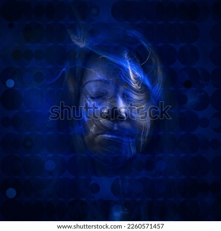 Similar – Beautiful young woman posing with blue makeup