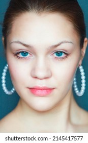 Face Of Young Caucasian Model With Smooth Smooth Skin And Beautiful Eyes. Front Portrait Of Girl Of 18-20 Years Old With Confident And Daring Look.