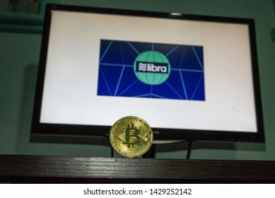 Facebook Cryptocurrency Libra’s With A Bitcoin In Front Of The Libra’s Image On A Computer Screen , Sydney Australia 20/06/2019