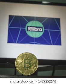 Facebook Cryptocurrency Libra’s With A Bitcoin In Front Of The Libra’s Image , Sydney Australia 20/06/2019