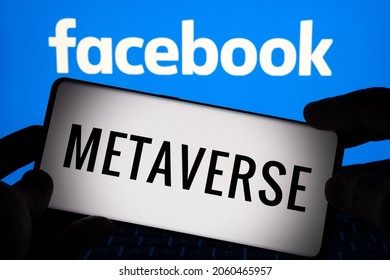 FACEBOOK META Metaverse concept. Smartphone silhouette with METAVERSE word and company logo on blurred background. Not a montage, real photo. Stafford, United Kingdom, October 19, 2021