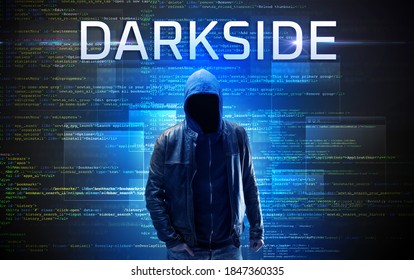 Faceless hacker with DARKSIDE inscription on a binary code background