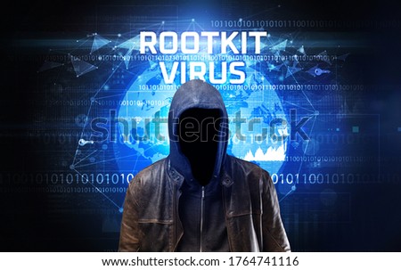 Faceless hacker at work with ROOTKIT VIRUS inscription, Computer security concept