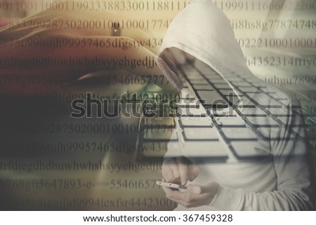Faceless hooded anonymous computer hacker