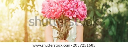 Similar – Florist woman arranges festive bouquet of flowers