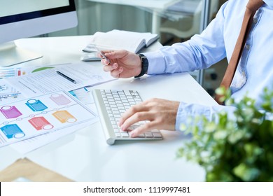 Faceless shot of man entering credentials from credit card into computer typing on keyboard.  - Shutterstock ID 1119997481