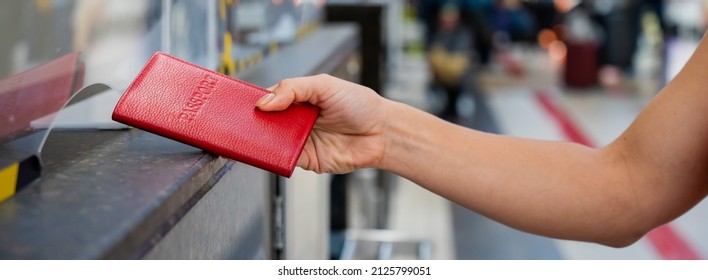 Faceless Woman Giving Her Passport At The Airport Check-in Counter.