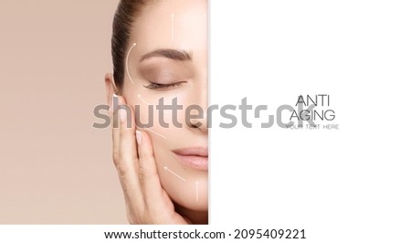 Facelift and Anti Aging Concept. Beauty Face Spa Woman with Lifting Arrows. Half face cropped with white copy space to the side. Beauty portrait isolated on beige background.