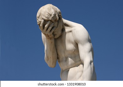 Facepalm - A statue with its head in its hand