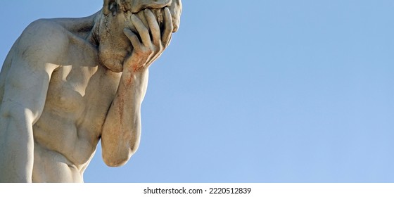 Facepalm - a statue with its head in its hand - Shutterstock ID 2220512839