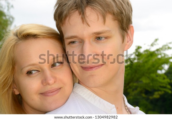 Faces\
of a happy couple of white Eastern European descent Toronto,\
Ontario, Canada - June 25, 2011 with model\
releases