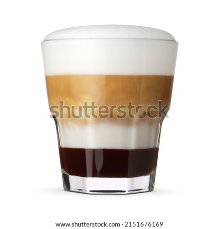 Faceted glass of layered coffee mocha isolated on white background with clipping path.