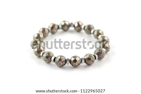 Faceted shiny pyrite bracelet isolated on white background