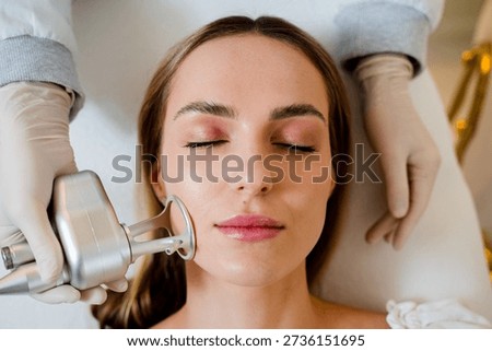 Facial CO2 laser resurfacing to remove wrinkles and scars in professional cosmetology