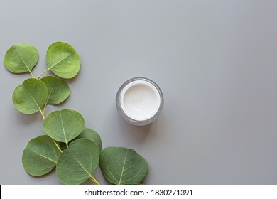 Facial Cream On Gray Background With Leaf. Flat Lay, Top View, Mockup, Template