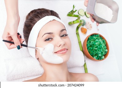 Facial mask of caucasian young female. Spa treatment