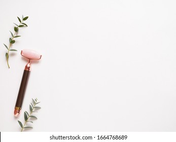 Facial Massage Jade Roller With Little Plant On White Background. Concept Skincare And Beauty Routine, Procedure, Minimal, Flatlay, Lay Out, Copyspace.