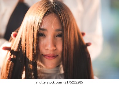 Facial Portrait Of Beautiful Woman Smiling And Feeling Good After Pampering Herself With Hair Spa And Haircut With A Hairwash In A Modern Salon With Male Hairdresser