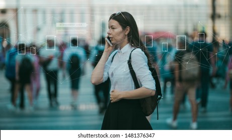 Facial Recognition And Search And Surveillance Of A Person In The Modern Digital Age, The Concept. Young Woman With Phone In Crowd Of People On The Street, Identification And Modern Technology