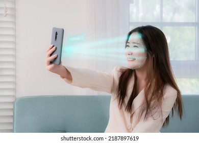 Facial Recognition Smartphone Technology Of Asian Business Woman Smile. Face Detection For Unlock  People Business, Analyzing, Scaning System Futuristics Function Concept.