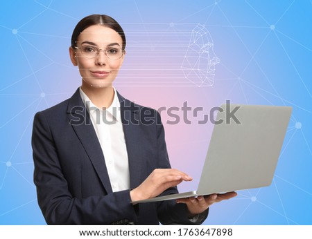 Facial recognition system. Woman using laptop on color background 