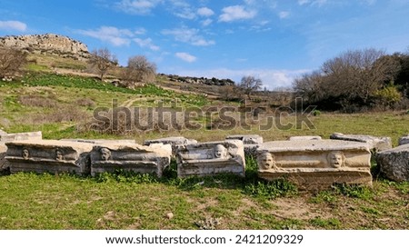 The facial reliefs carved on marble rock to show the type of plays such as comedy, tragedy, etc. in the amphitheater of the  Castabala, which was an antique city dates back 2500 years. It is locate