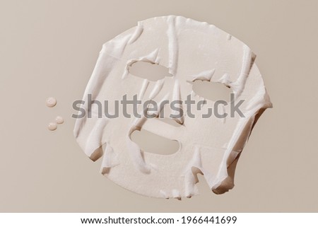facial sheet mask on brown background. 