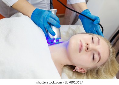 Facial Skin Care In The Beauty Parlor Using Cryo Care. Hardware Cosmetology In The Spa Salon.