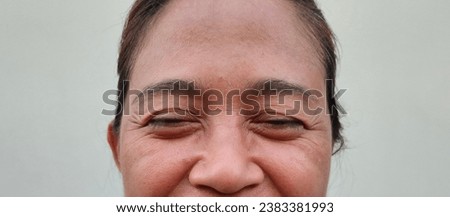 Facial skin problems of freckles, dark spots and wrinkles on the faces of Asain women stressed expression, crow feets, frowning, Dry and rough skin, Isolated on white background and concept of healthy