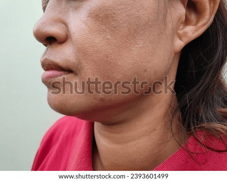 Facial skin problems of freckles, dark spots and wrinkles on the faces of middle-aged Asain women stressed expression, frowning, Dry and rough skin, Isolated on white background and concept of healthy