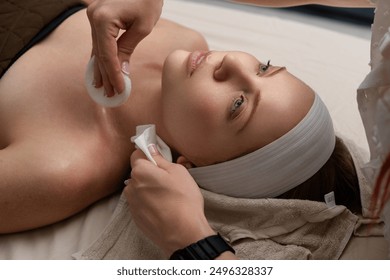 Facial treatment. Beauty skin, skincare massage in a beauty clinic. Facial lifting massage in SPA salon. A cosmetologist girl does a facial massage. Cosmetic procedure. Beauty spa and cosmetology. - Powered by Shutterstock