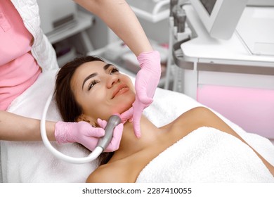 Facial treatment, Rejuvenating facials,Hydro-microdermabrasion,Skin therapy,Rejuvenation treatment,cosmetology procedure. The aesthetician is giving the woman a facial at the spa - Shutterstock ID 2287410055