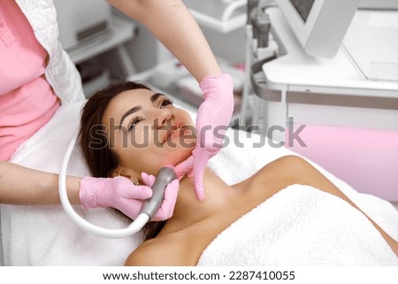 Facial treatment, Rejuvenating facials,Hydro-microdermabrasion,Skin therapy,Rejuvenation treatment,cosmetology procedure. The aesthetician is giving the woman a facial at the spa