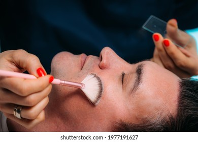 Facial Treatments For Men. Chemical Peel Face Treatment With Retinol Serum. Cosmetician Applying Retinol Serum On Man’s Face