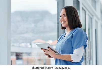 Facilitating Effective Data Management With Smart Tech. Shot Of A Medical Practitioner Using A Digital Tablet In A Hospital.