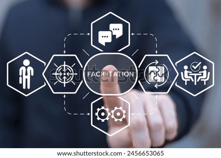 Facilitator working on virtual touch screen presses word: FACILITATION. Concept of facilitation. Business and finance facilitating.