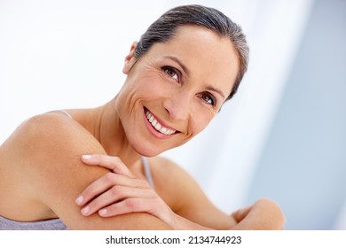 Facing age with a carefree attitude. Cropped portrait of a beautiful mature woman posing in studio. - Shutterstock ID 2134744923