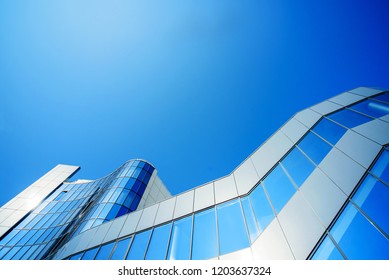 Facing The Building With A Ventilated Facade. Aluminum Colored Facades. Modern Facades Construction Of A Comercial Centre
