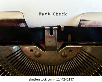 Fact Check, heading title typewritten in black ink on white paper on vintage retro old fashioned obsolete typewriter machine - Shutterstock ID 1144242137