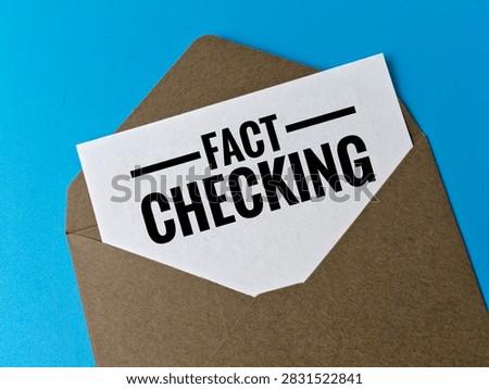 Fact Checking Concept with Document Letter Inside Envelope on Blue Background, Information Verification, Research, Accuracy and Journalism. 