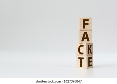 Fact or Fake concept, Wooden cube change the word, April fools day