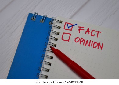 Fact And Opinion Write On A Book. Supported By An Additional Services Isolated Wooden Table.