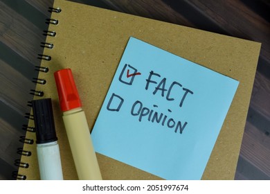 Fact Or Opinion Write On Sticky Notes Isolated On Wooden Table.