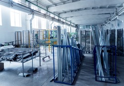 Factory for aluminum and PVC windows and doors production. Details industrial equipment. Background, an Industrial Photo by Roman Zaiets