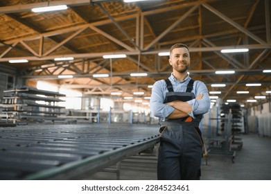 Factory for aluminum and PVC windows and doors production. Manual worker assembling PVC windows and doors. - Shutterstock ID 2284523461